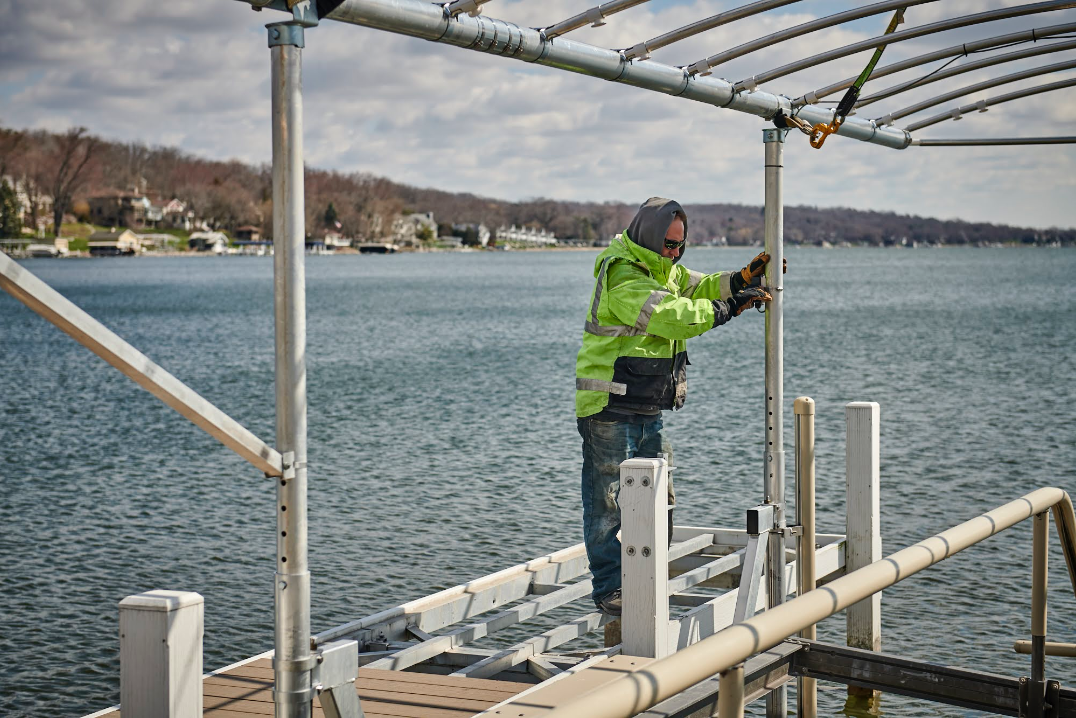 Employee installing a pier